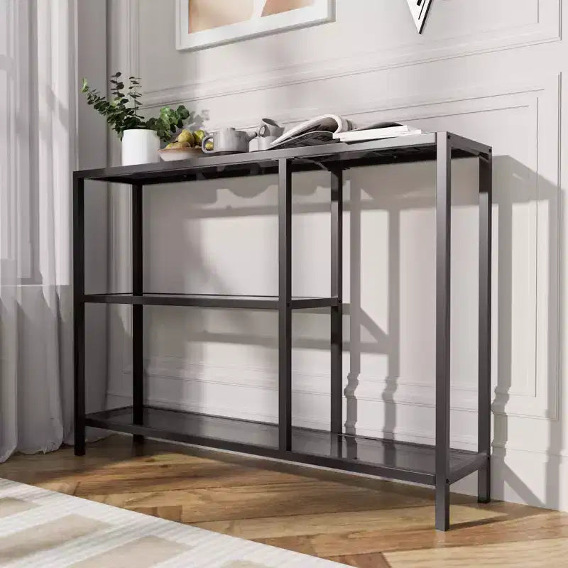 Consola elegante de metal y vidrio de tres niveles