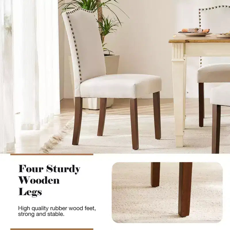 Juego de 2 sillas de comedor modernas sin brazos, tapizadas en tela, con adornos de tachuelas y patas de madera