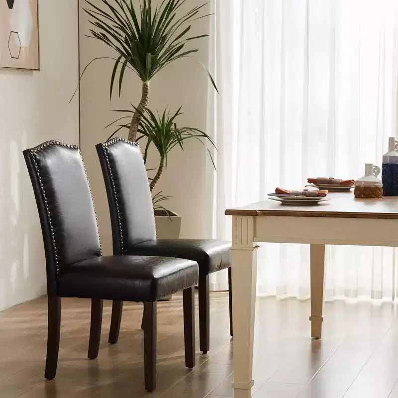 Juego de 2 sillas de comedor modernas sin brazos, tapizadas en tela, con adornos de tachuelas y patas de madera